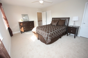 Master bedroom staged in a vacant home 