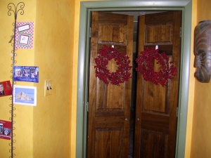 Simple berry wreaths on wood doors